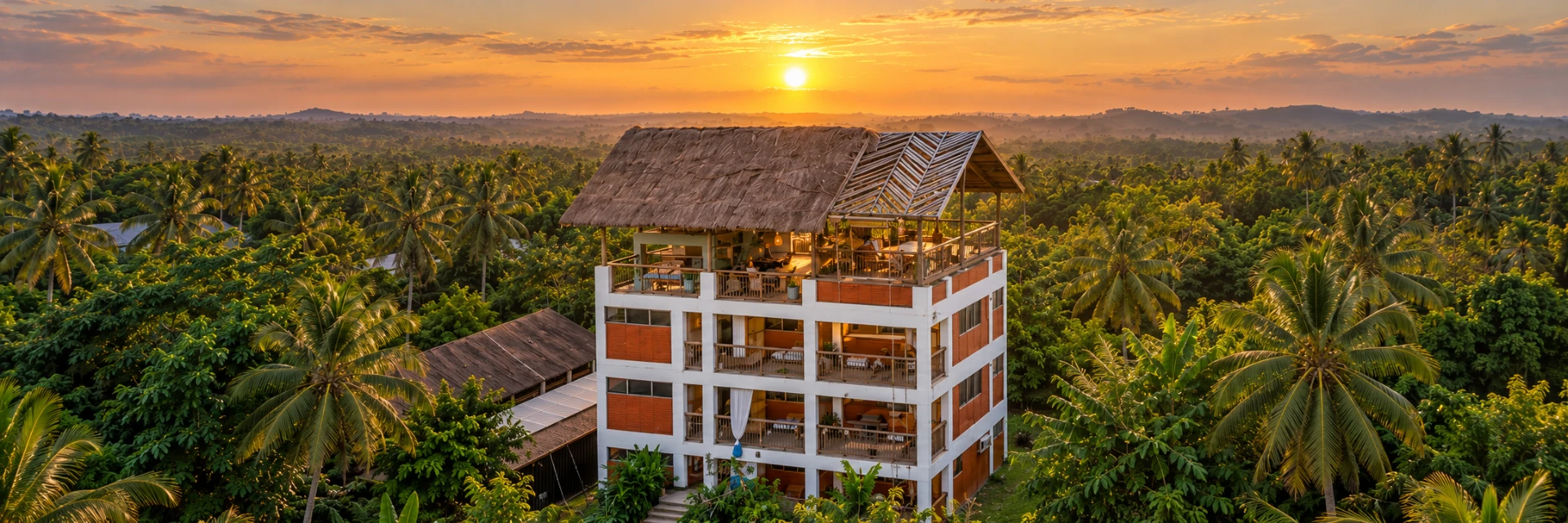BokoBoko guesthouse surrounded by palm trees at sunset